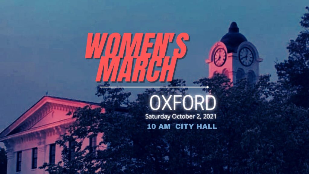 Image of the square clock tower text that reads: Women's March Oxford Saturday October 2nd 2021